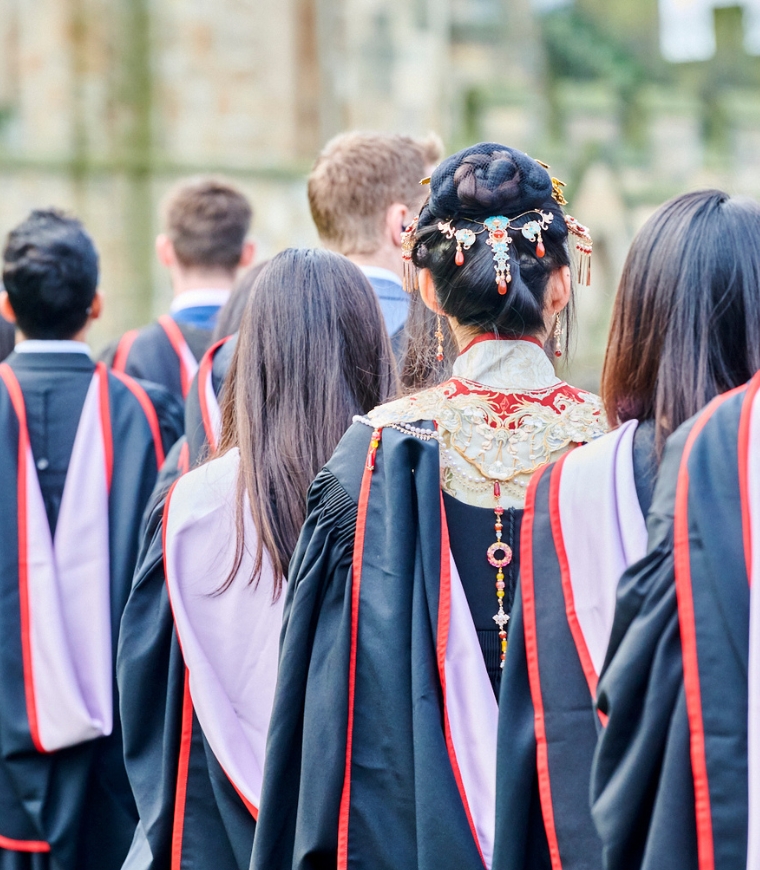 Durham university students in their robes graduating