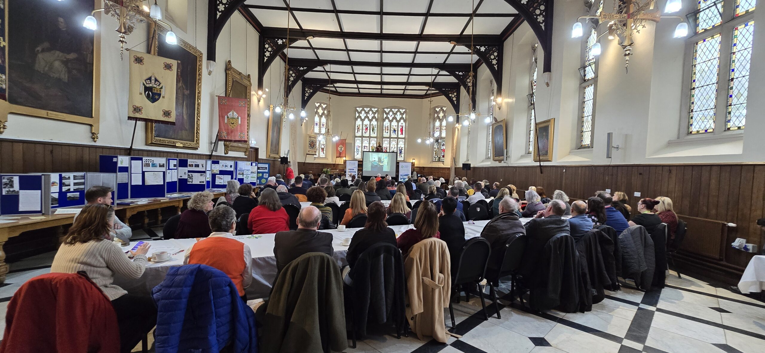 A group of people in a conference hall