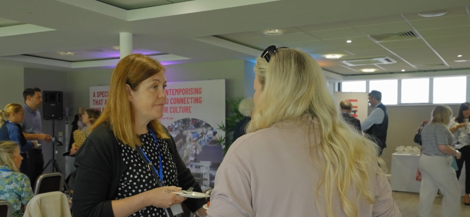 Two women talking at the Durham Champions event